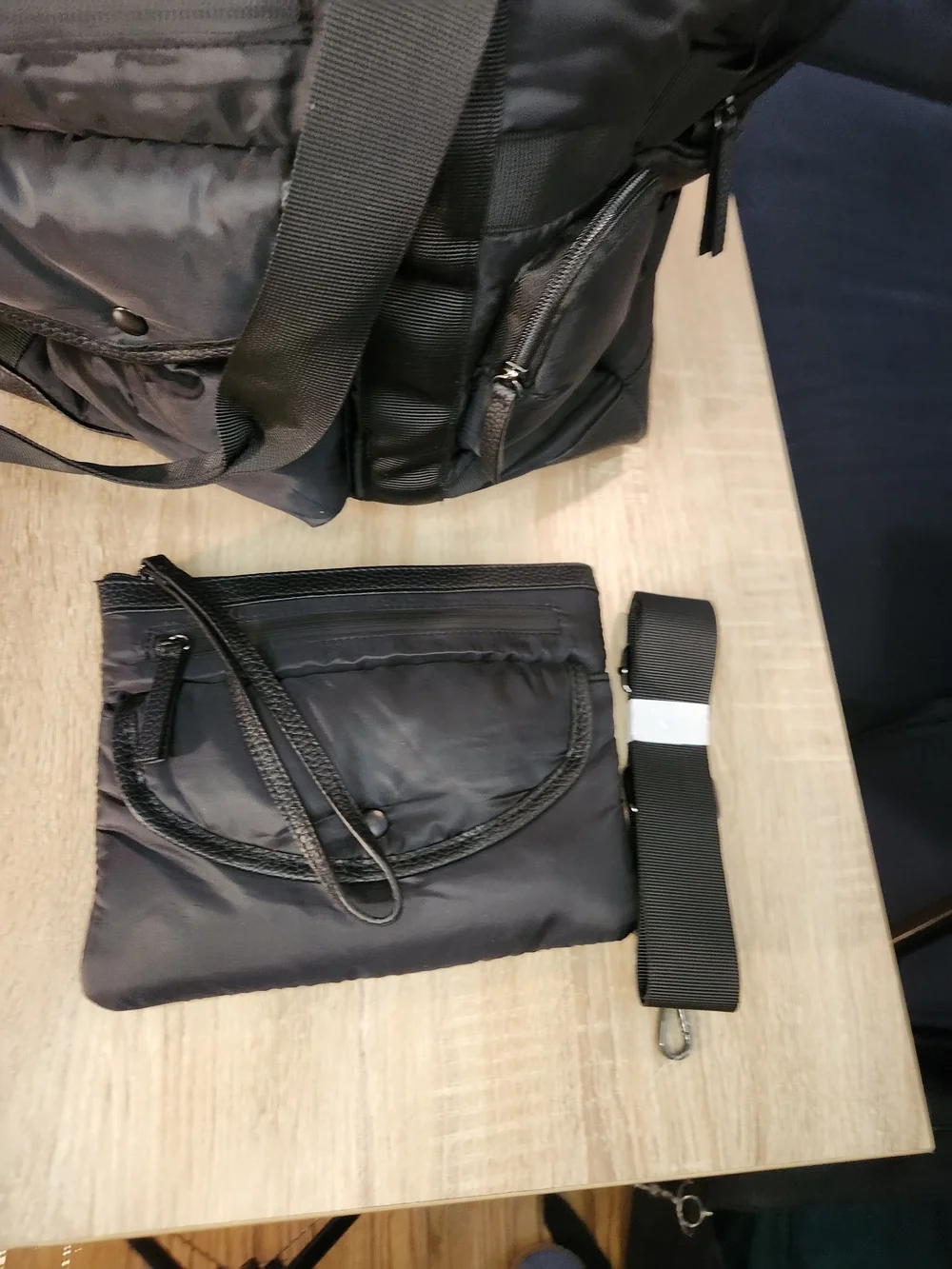 Tommy Bahama black Nylon and leather Weekender Bag featuring a trolley sleeve.